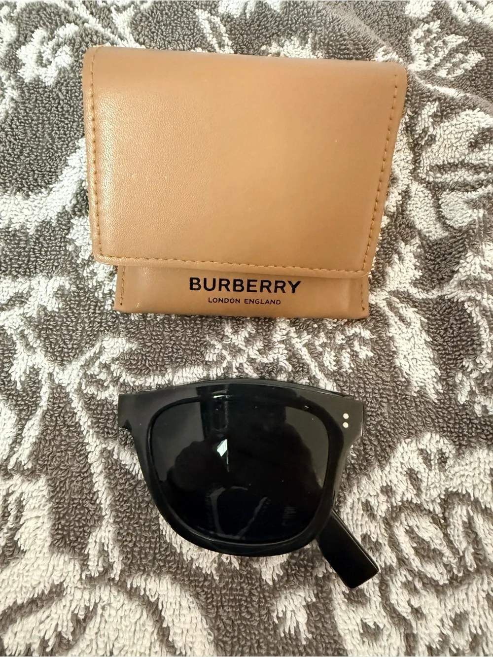 Burberry folding sunglasses.